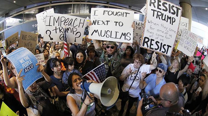 Trump travel ban is ‘dimming the lamp of liberty’