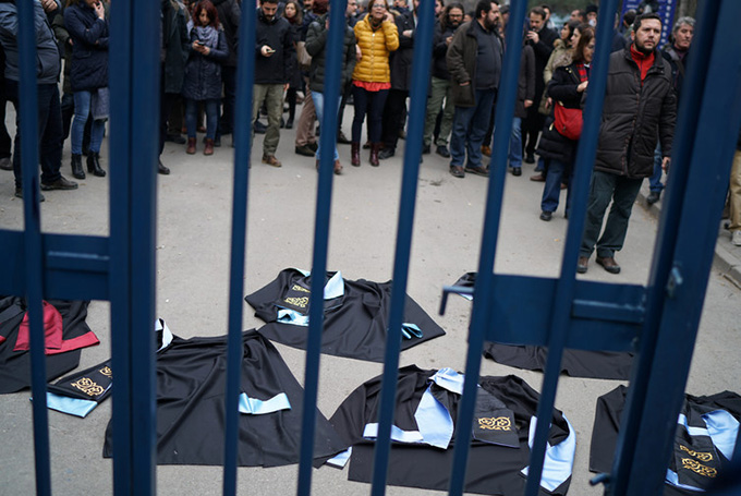  Academics lay down their gowns during a protest. Umit Bektas/Reuters 