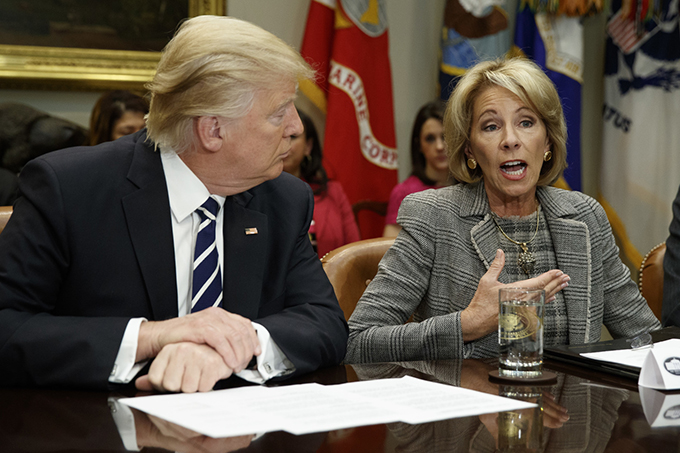  President Donald Trump and Secretary of Education Betsy DeVos are known advocates of school choice and charter schools. Evan Vucci/AP Photo 