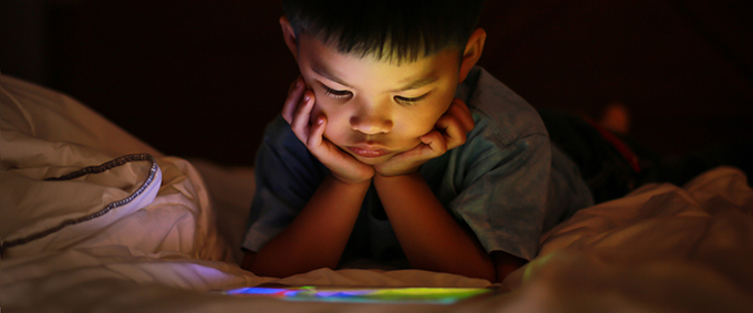 We’re told to limit kids’ screen time. But how does it actually affect their health?